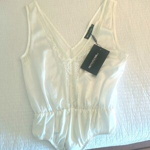 Plunge neck cream bodysuit